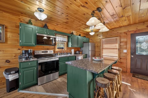 Fully stocked kitchen with Granite Countertops and Stainless Steel Appliances.