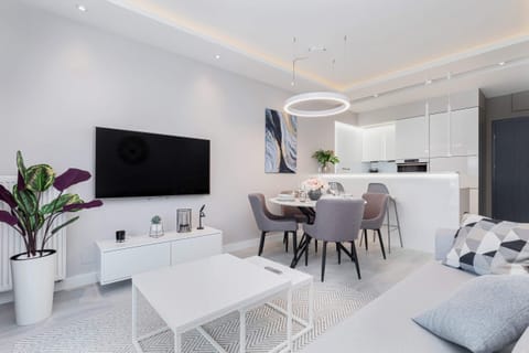 A small living area with a white coffee table, simple furniture, and an inviting ambiance.