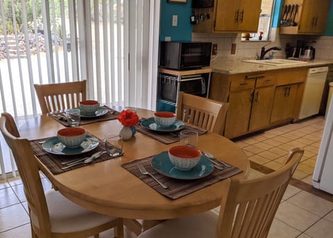 Microwave and toaster oven. Dining room table extends to seat six.