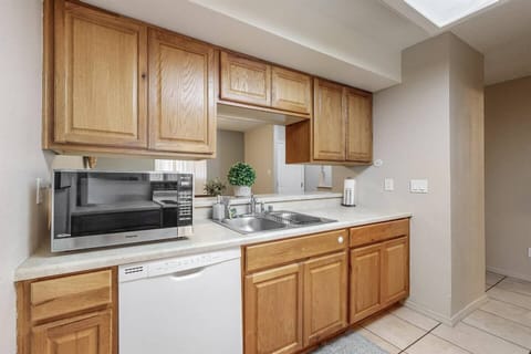Kitchen has ample preparation space to cook a simple meal