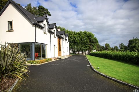 Outside view of the front and side grass garden