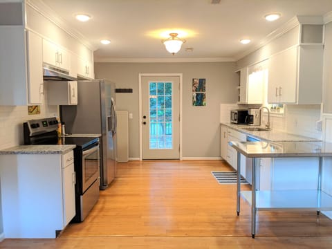 Stainless Steel Appliances. Back door leads to the deck.