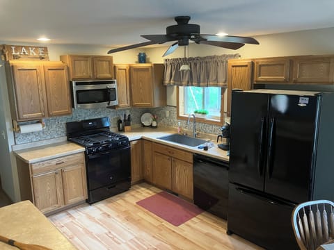 Kitchen Gas Stove, Dishwasher, Microwave, Refrigerator. 