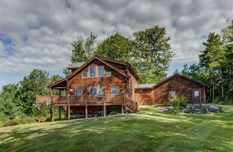 Perched on the hillside on 17 acres surrounded by serene and peaceful woods, this Coventry Log home is modern, classy and comfortable at once.