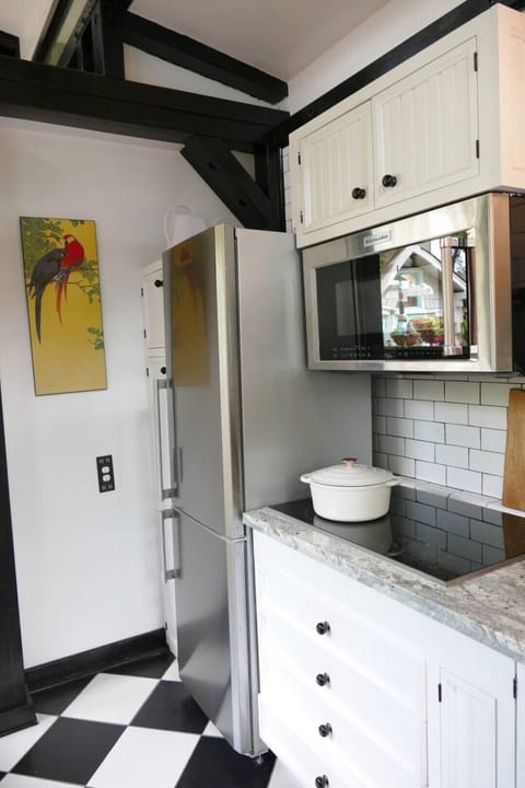 Full refrigerator, cook top, combo microwave/convection oven.