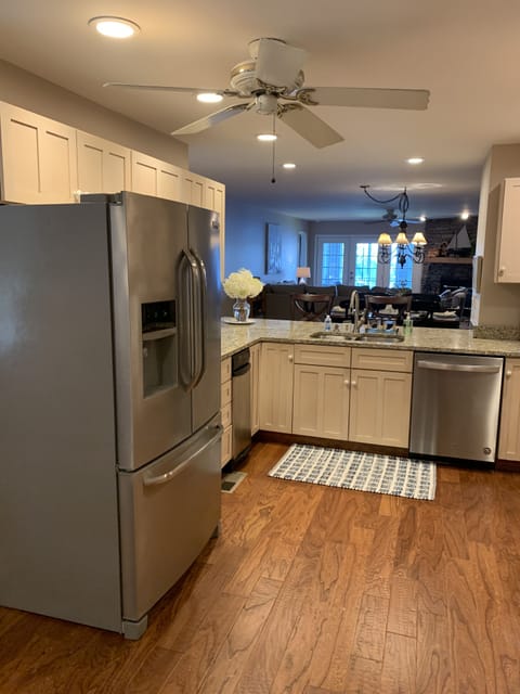 Kitchen with Fridge, dishwasher and garbage compactor