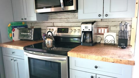 Well-stocked kitchen with modern updated appliances