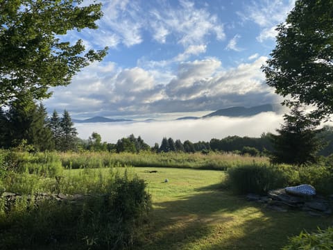 View from the dining area, north side of the deck, fire pit in center. 