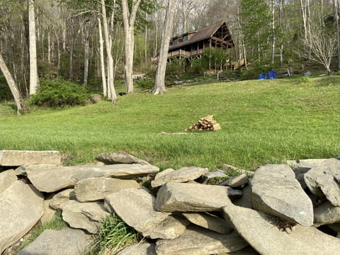 View from the river past the fire pit up to the house. 
