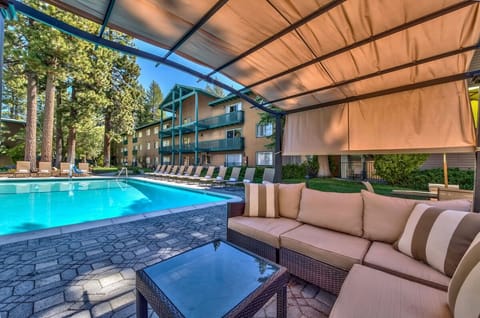 Unwind under the cabana with pool views and cool shade.
