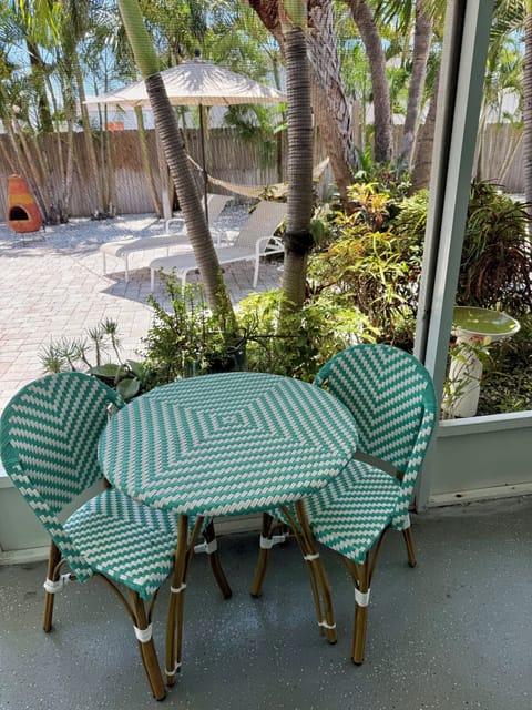 Enjoy alfresco dining on the screened in patio
