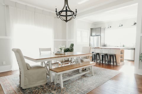 Dining room open to the kitchen, sliding doors to the side deck with grill. 