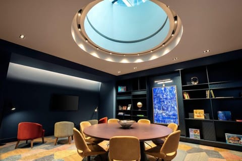 Board-style table set for six in The Den meeting room
