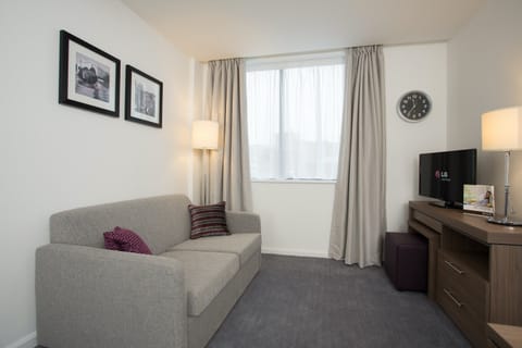 Relax on the sofa and watch a show on the TV after a day outside.