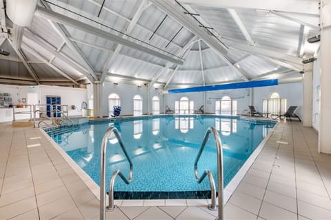 Another view of the indoor pool, showcasing the expansive space and multiple lanes.