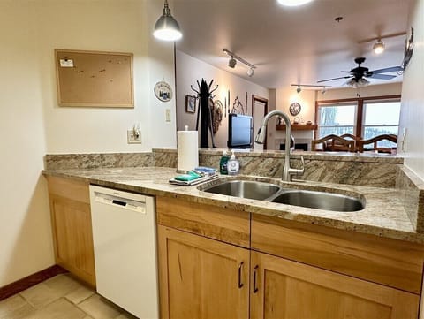 Kitchen overlooking breakfast bar and into the dining and living room