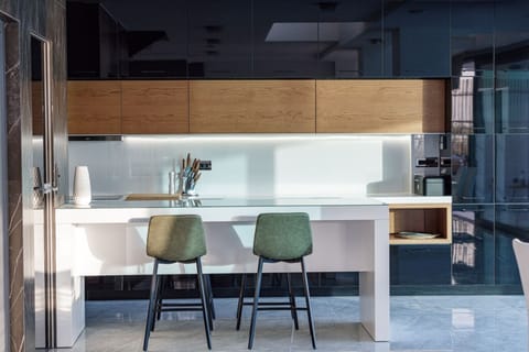 The kitchen is fully equipped with all necessary appliances and an additional breakfast table for 4 people