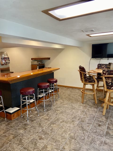 Lower level walkout with bar area, 1/2 bathroom, washer, dryer and 2nd fridge.