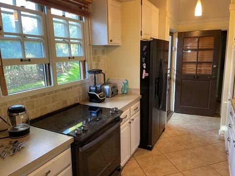 Kitchen with vegan friendly blender, toaster, rice pot, coffee and hot water pot