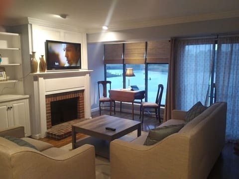 Living room with cozy sitting area/working area overlooking relaxing views.