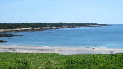 View from our 1820's home looking over the ocean and sandy beach.