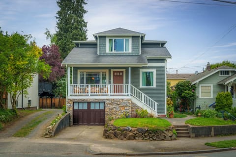 Well-maintained exterior with lush greenery surroundings.