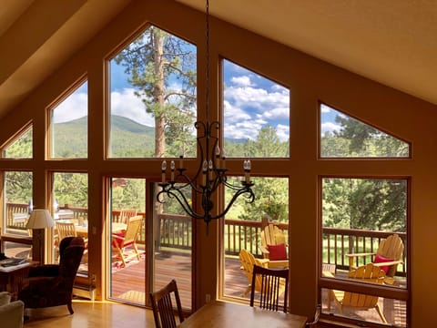 Great room to the back deck overlooking the meadow and the foothills. 