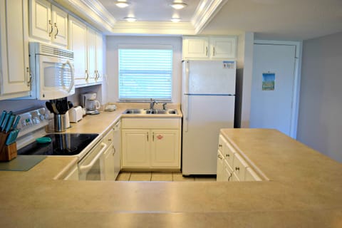 Looking towards the entry and kitchen from the high bar.
