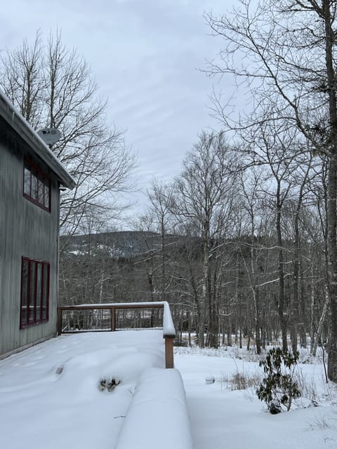 side of house new deck and views of western mountain in the winter months 