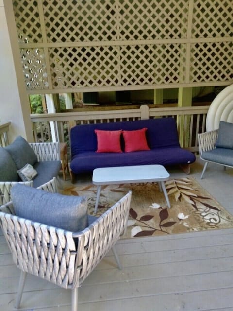 Very large lower level deck with dining seating area and hot tub