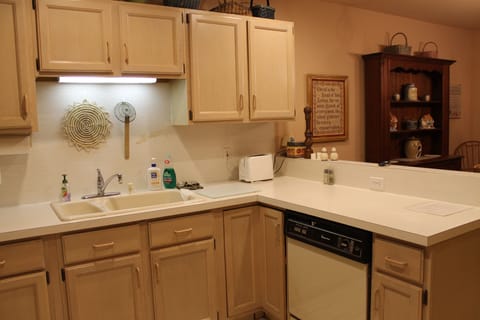 Kitchen complete with pots, pans, dishes, utensils, and appliances