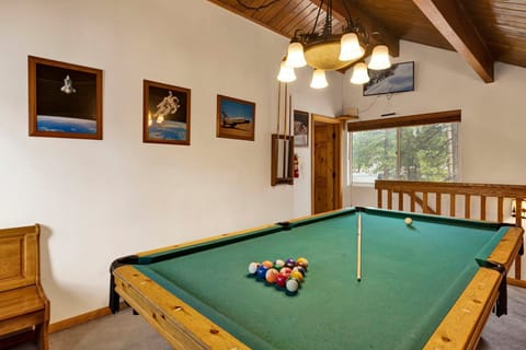 Fun-filled game room with a pool table perfect for family fun, friendly competition, and unforgettable entertainment during your stay.