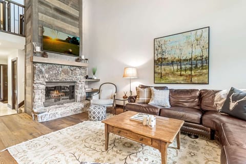 The living room is the perfect spot to unwind by the fire with a cocktail and a good book.