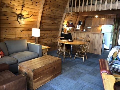 Dining table and secondary seating area make for ample places to be together