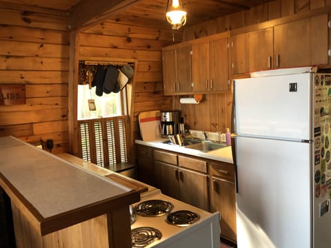 Galley kitchen with a 24-inch range and refrigerator