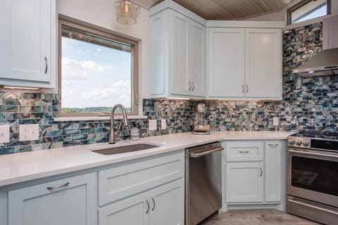 Window with a view to pool and hills.