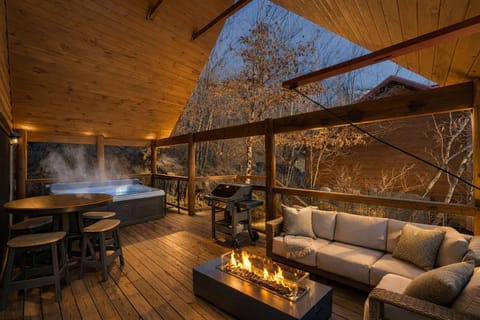 Large deck with rocking chairs, gas fire pit, sectional seatinggrill, hot tub