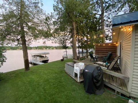 The front yard overlooking the lake. We added a privacy fence & string lights!