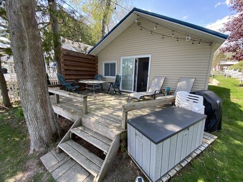 Front deck (overlooks the lake) with new privacy fence & string lights overhead.