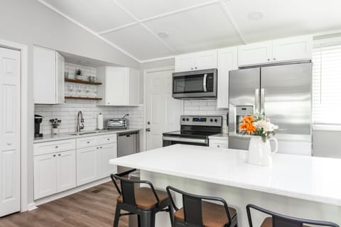 Kitchen with quartz counters and stainless steel appliances