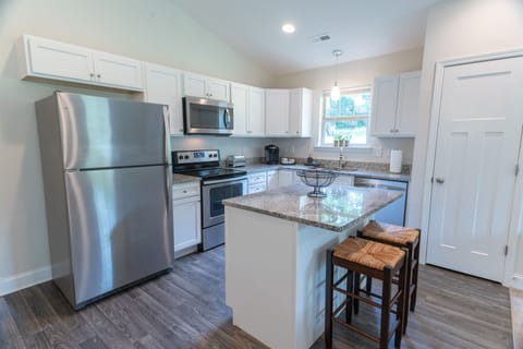 Our kitchen is equipped with pots, pans, utensils, and cleaning supplies