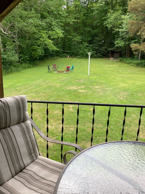 Enjoy your coffee on the porch overlooking a large quiet back yard