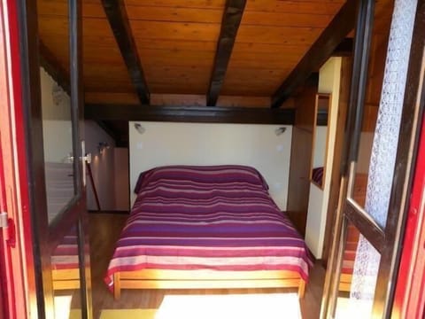 Sleeping area. Sunny bedroom with balcony