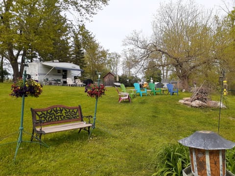 tranquil setting of our backyard with firepit for your pleasure