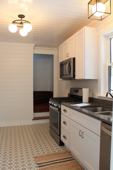 Kitchen appliances also included: refrigerator, oven, microwave, & coffee maker.