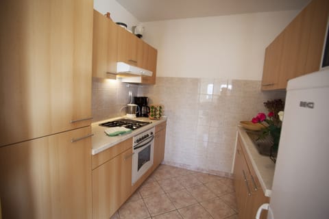 Galley kitchen with fridge freezer, over, kettle, toaster, all you need for stay