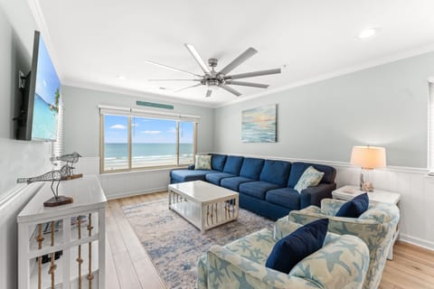 Bright, open living room with excellent views of the beach!