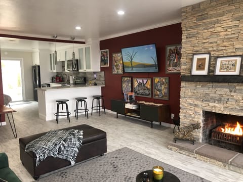 Living room w/TV, games, and plenty of sitting spaces. Additional sleeping space