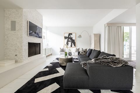 Living room with big sectional and 55" Samsung Frame TV.