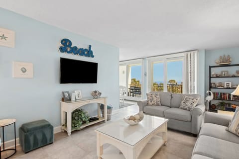 Living Area with Sofa, Loveseat, Flat Screen Smart TV, and Gorgeous Oceanfront Views
